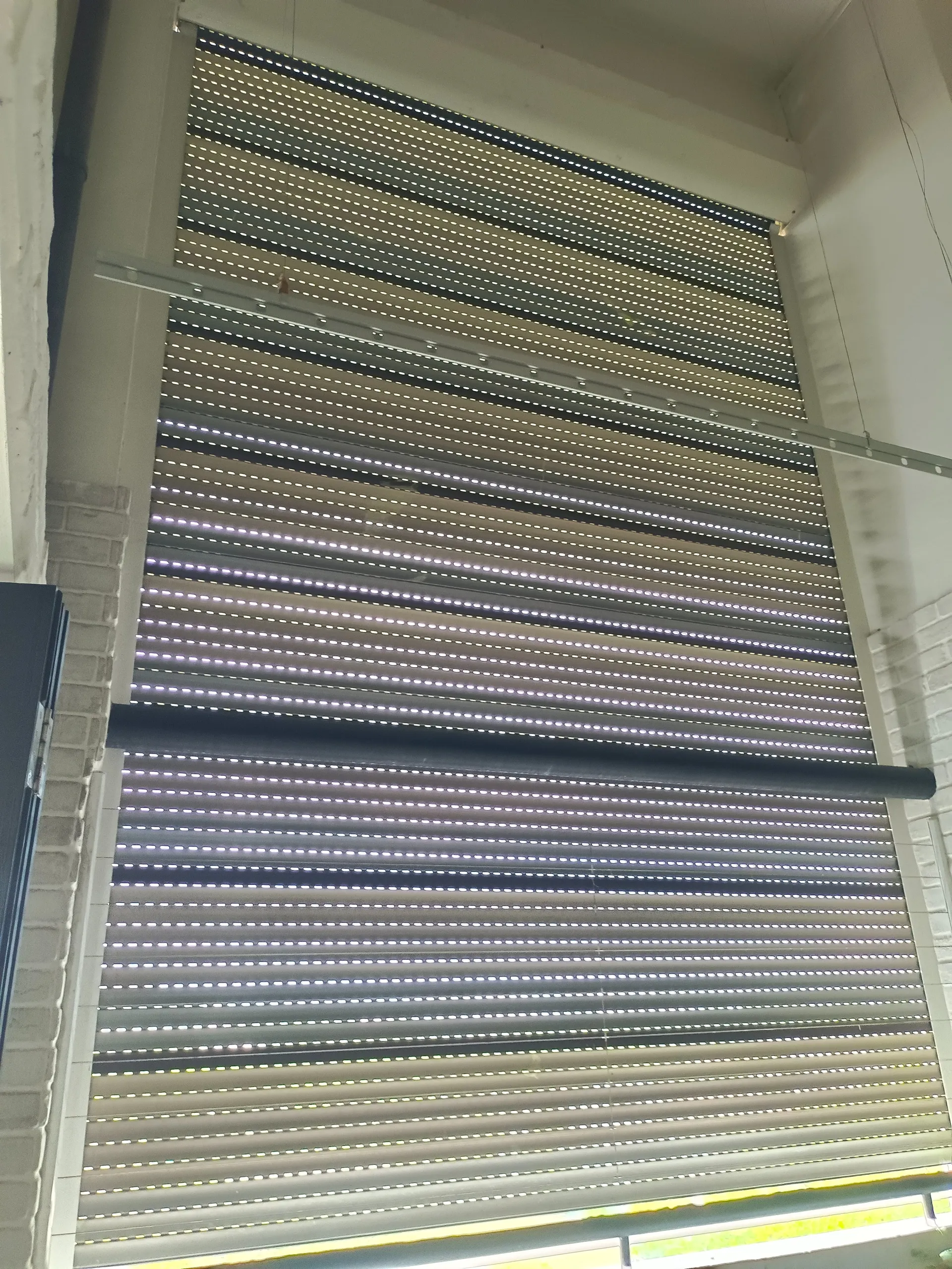 Shutter is broken on one side.