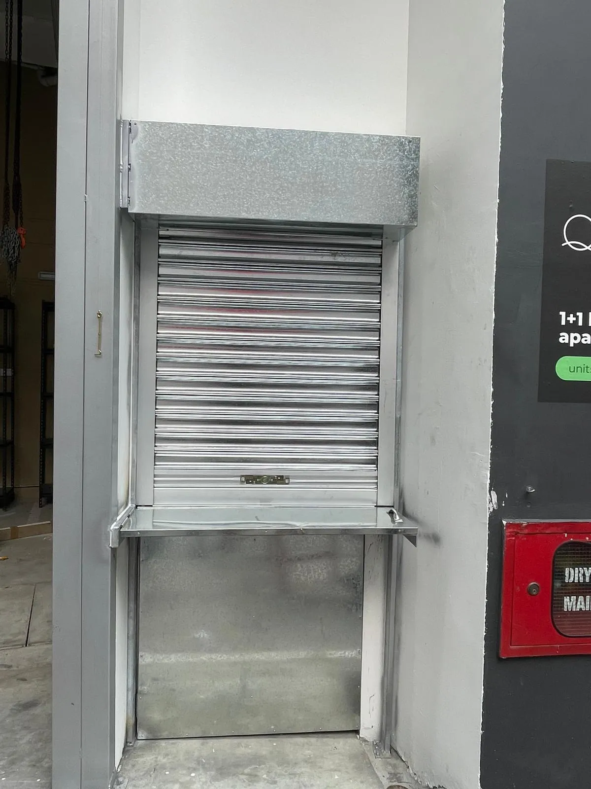 Manual Roller Shutter & Integrated Delivery Counter Installation at Mohamed Sultan Road - Roller Shutter Project in Singapore