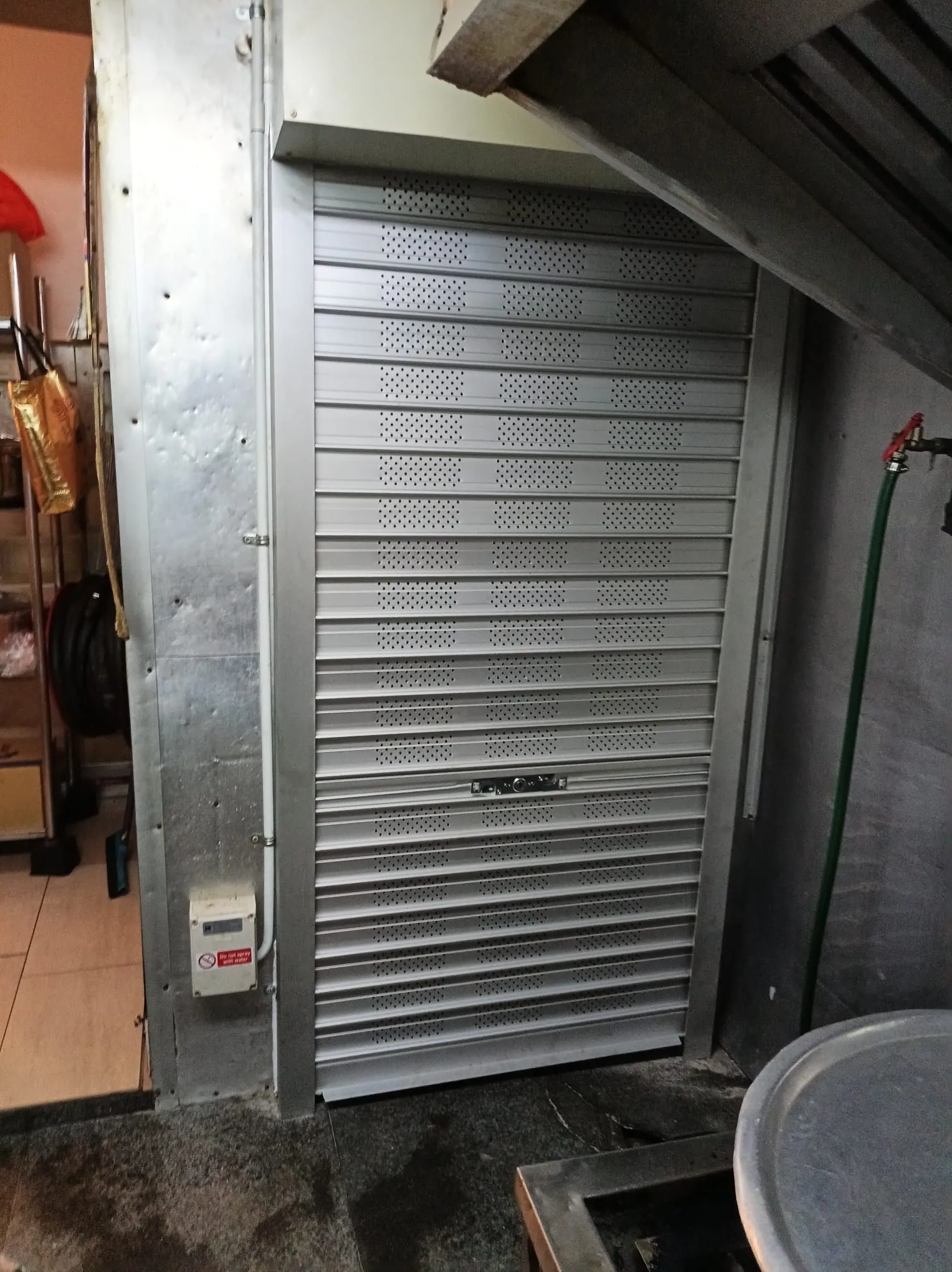 Manual Perforated Roller Shutter Installation for Commercial Kitchen at Norris Road, Singapore - Roller Shutter Project in Singapore
